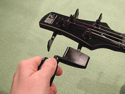 Unwind each bass string