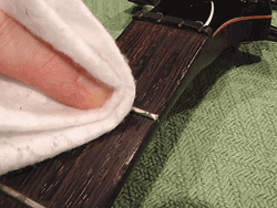Wipe frets and fretboard clean